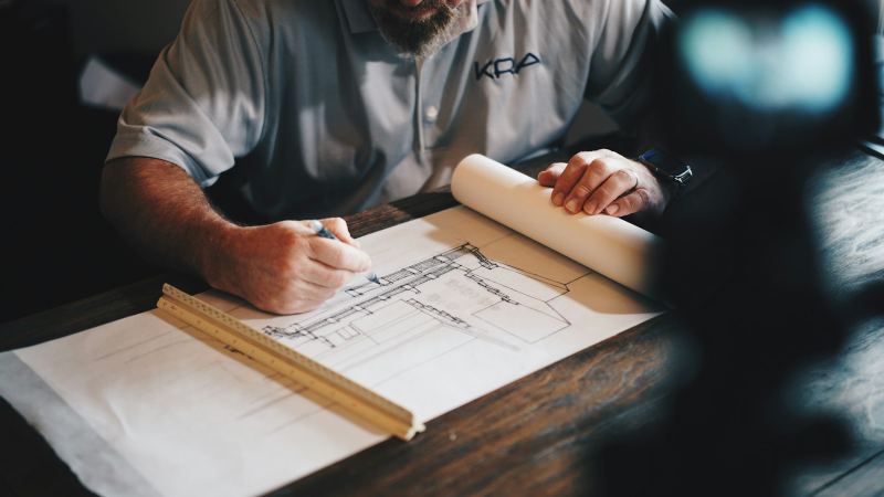 Engineer marking up construction drawings