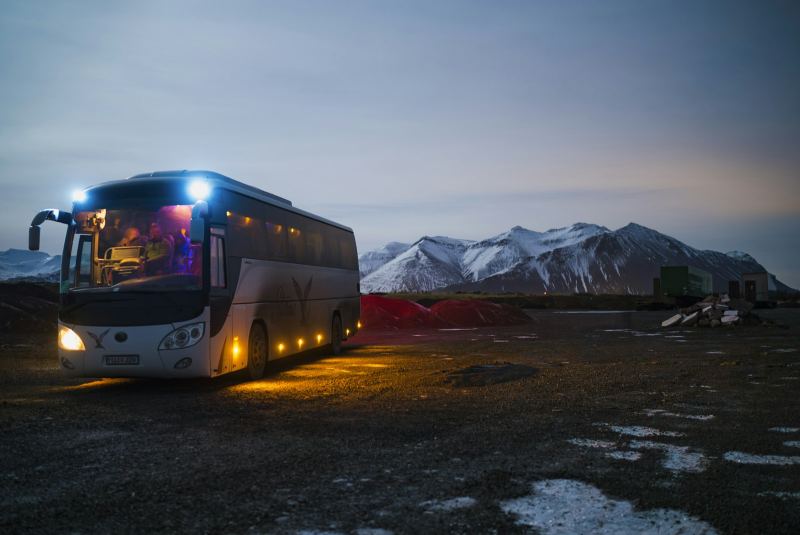 Coach bus travelling at dusk
