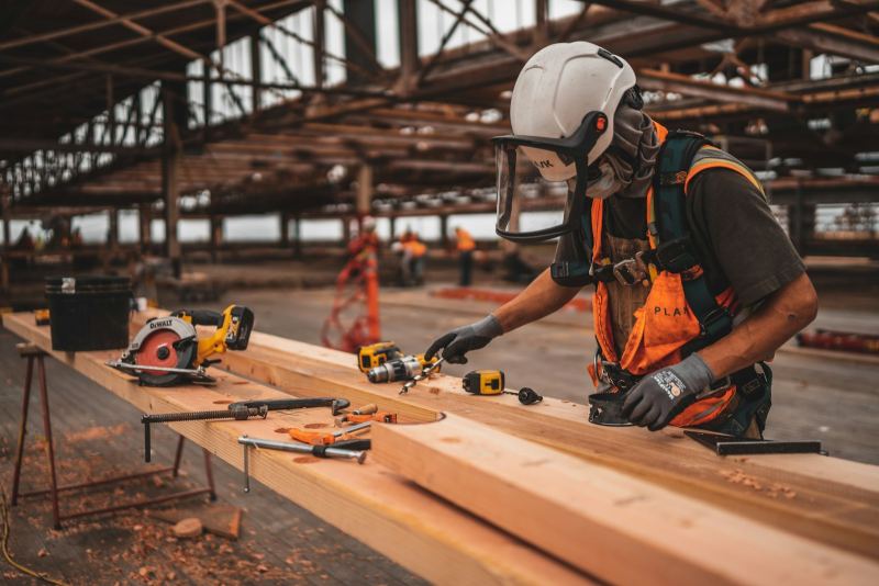 Fabricator working on a structure in a workshop